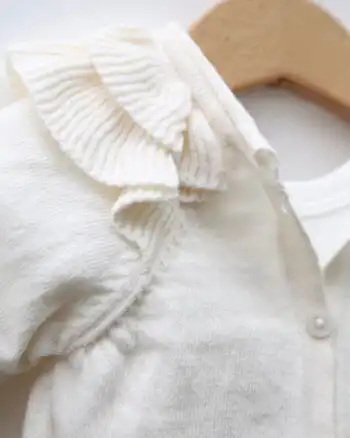 Knit kompletić NipperLand "Cvetići" (bež)